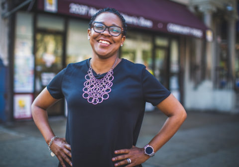 Harlem Children's Zone Community Pride Director Latasha Morgan wears a black blouse and smiles