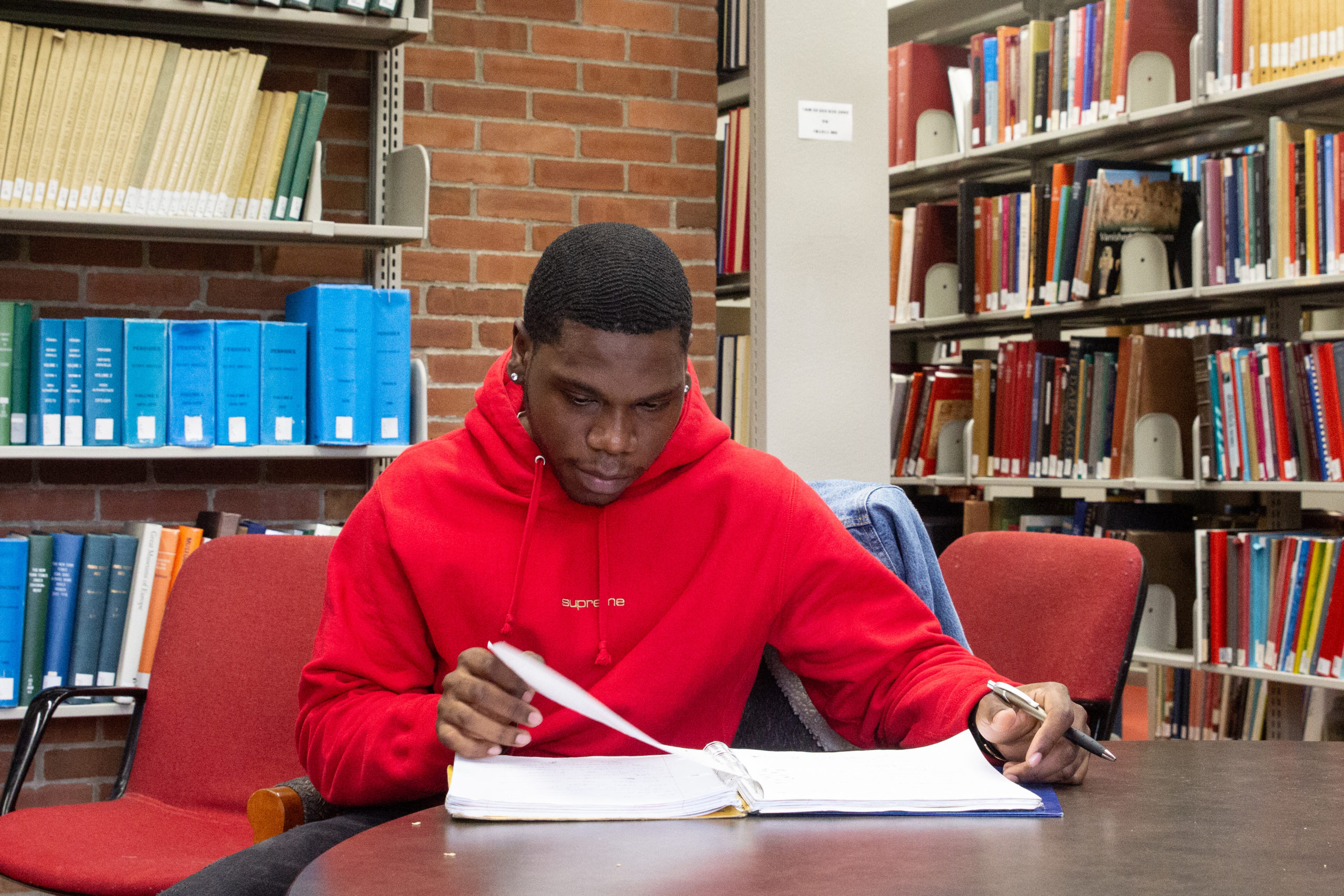 Harlem Children's Zone scholar visit a college library.