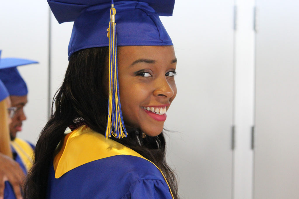 A young woman graduate smiling