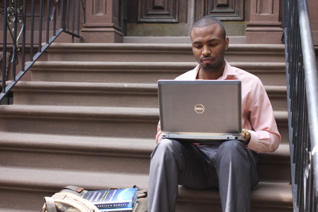 Man sits with a laptop