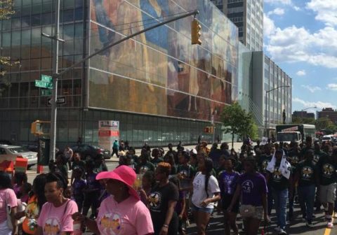 Participants march down the street.