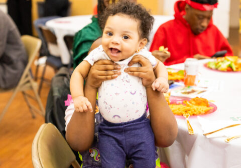 Baby smiling at the camera