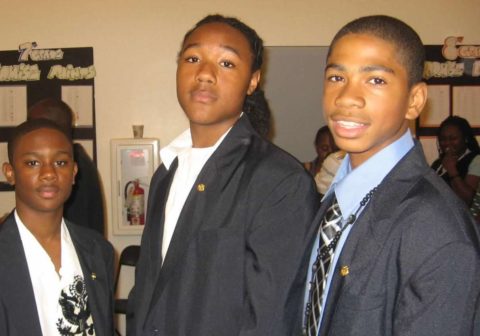 A young Deondre Coston posing with classmates.
