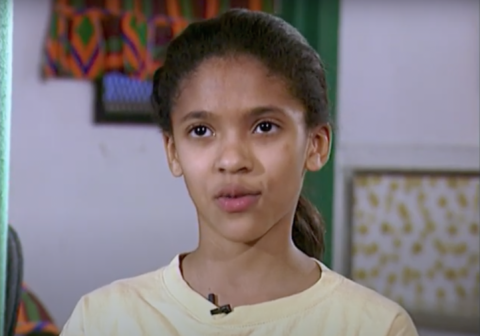 A young Reyna Bonaparte speaks into the camera.