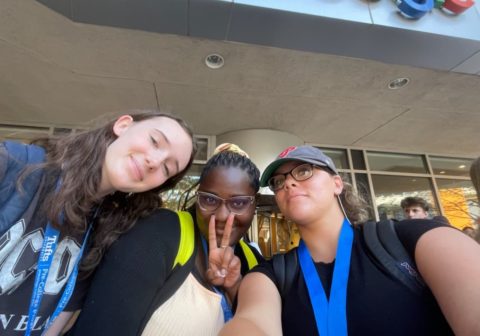 Three students pose outside of Google's offices.