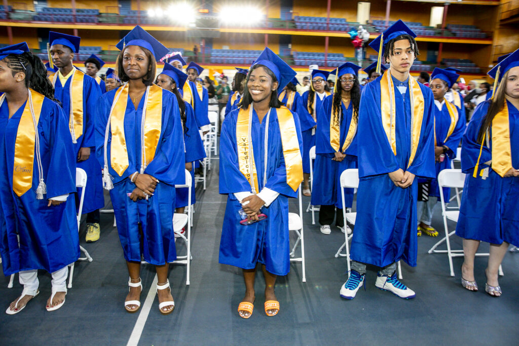HCZ Promise Academy High School seniors smile in graduation day at The Armory.