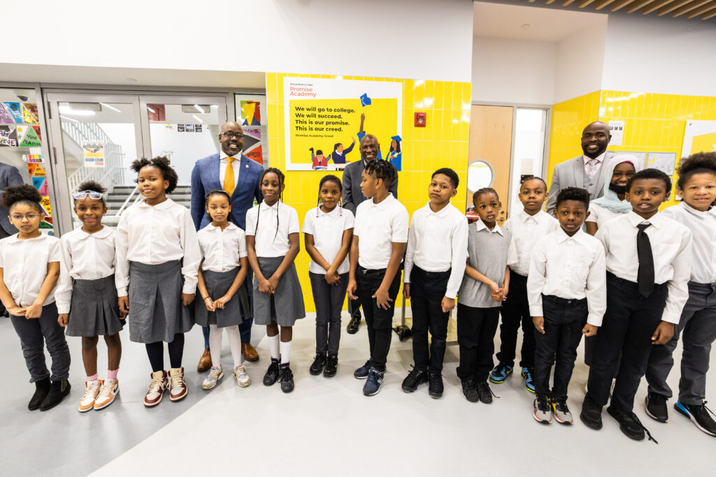 Harlem Children's Zone CEO, Kwame Owusu-Kesse, Founder and President, Geoffrey Canada, and Superintendent, Dr. Achil Petit, celebrate the opening of Promise Academy II with scholars.