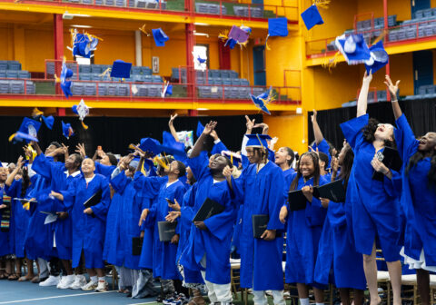 Group image of scholars celebrating graduating