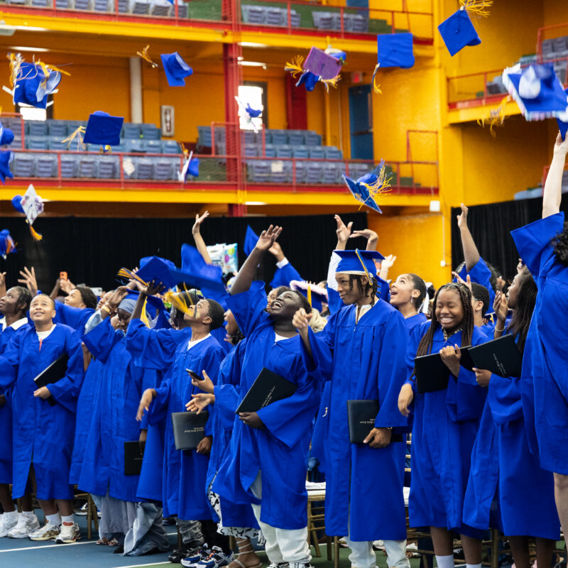 Group image of scholars celebrating graduating