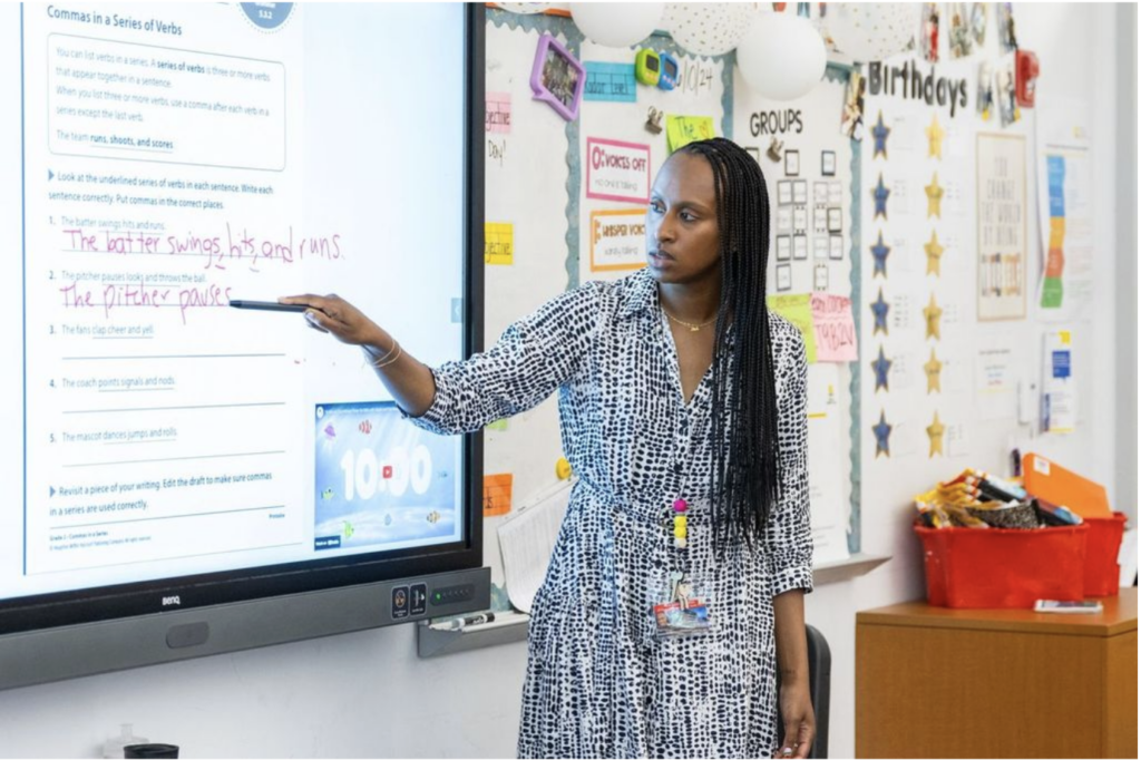 Natalia Pierre teaches a lesson in front of her class.