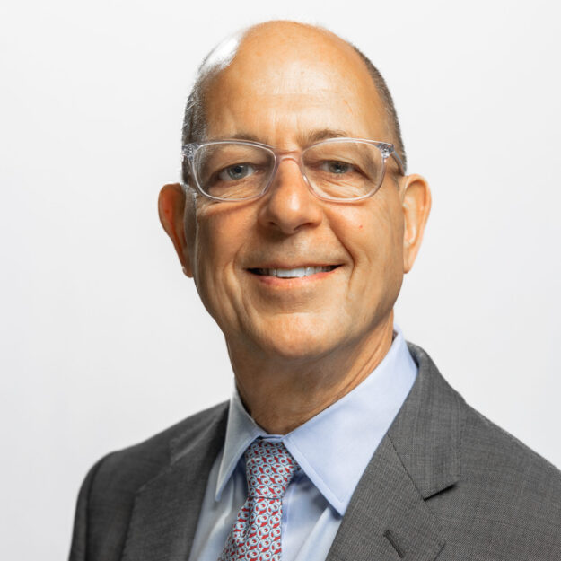 Man in grey blazer and tie