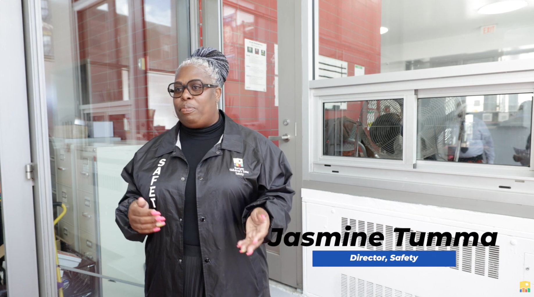 Safety team director dressed in uniform standing in the school lobby